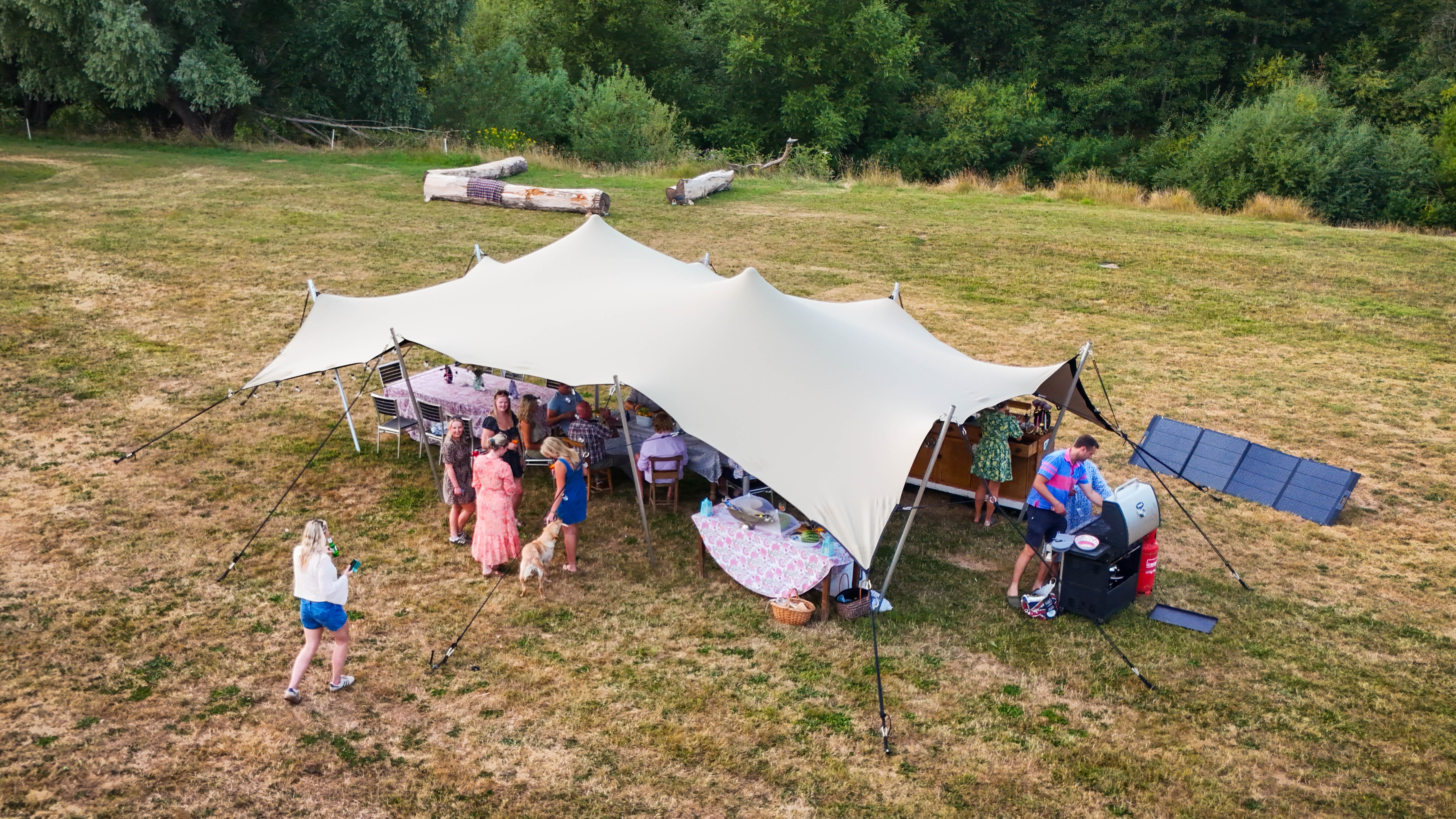 Playing badminton in the meadow at Hopnest glamping retreat
