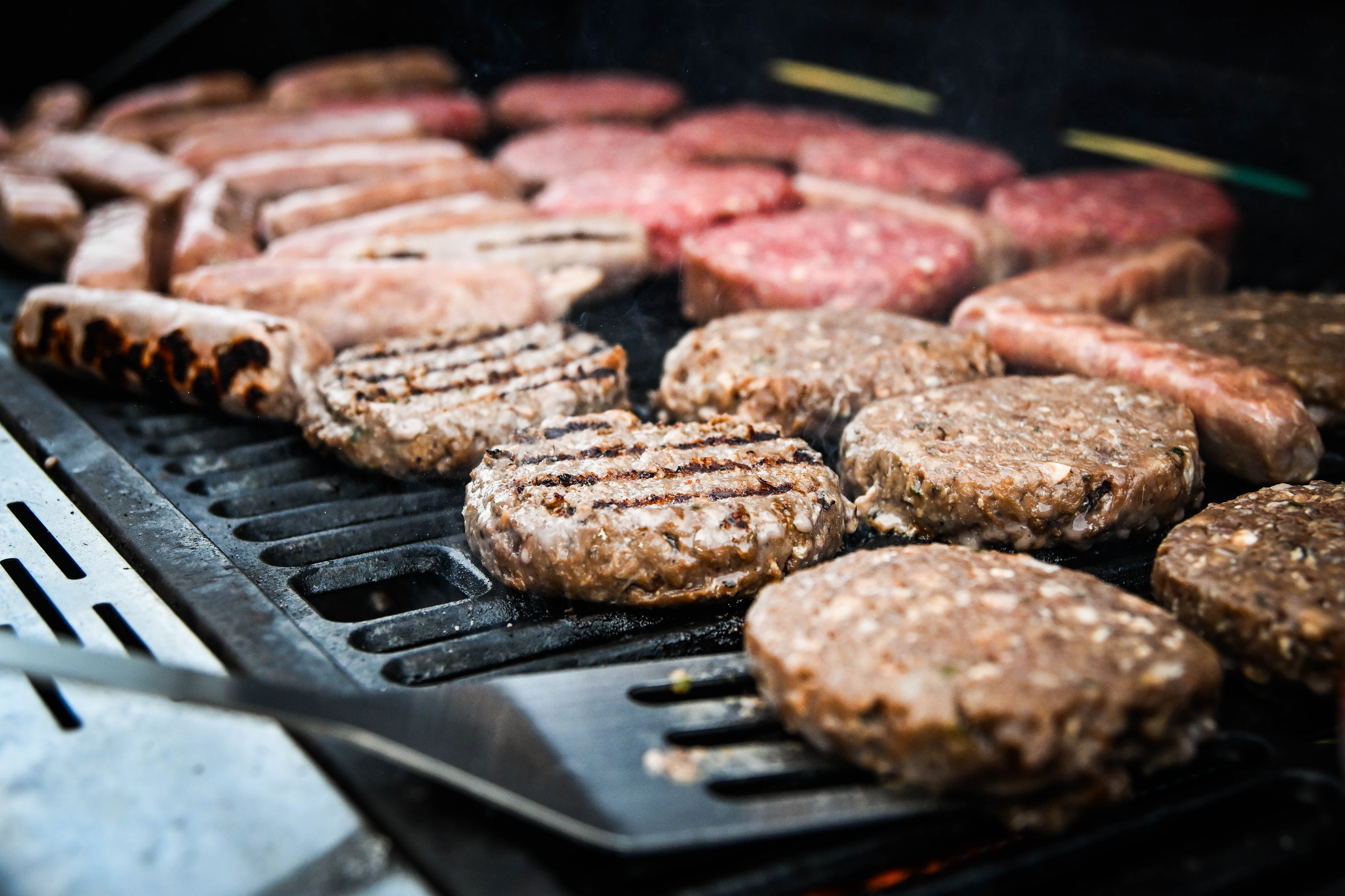BBQ cooking at the outdoor kitchen at Hopnest Retreats